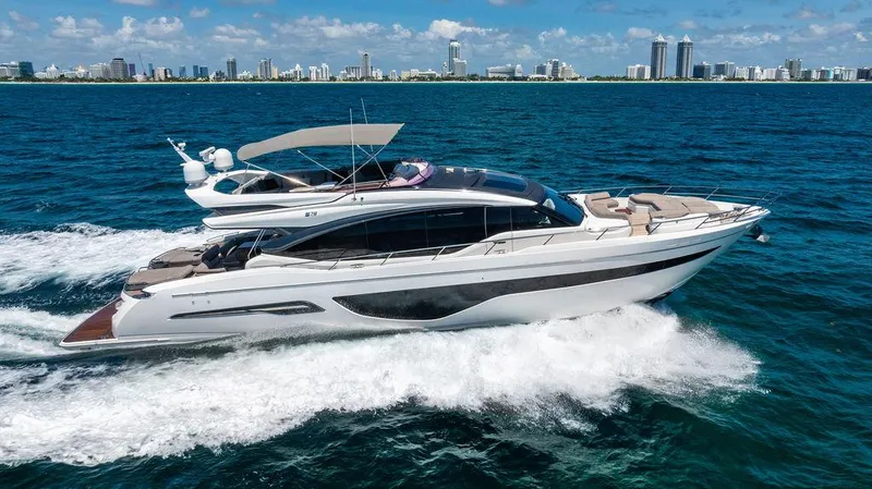 Cocoon Yacht Photos Pics Luxury Princess S78 yacht cruising on blue ocean near city skyline, 2021 model.
