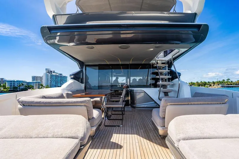 Cocoon Yacht Photos Pics Luxurious 2021 Princess S78 yacht deck with seating, table, and ocean view.