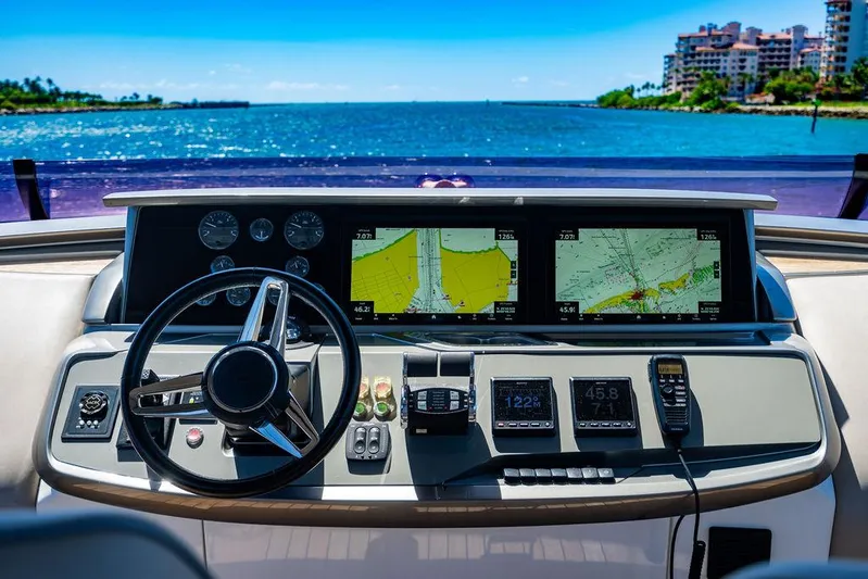 Cocoon Yacht Photos Pics Helm of 2021 Princess S78 yacht with navigation screens and controls, overlooking ocean view.