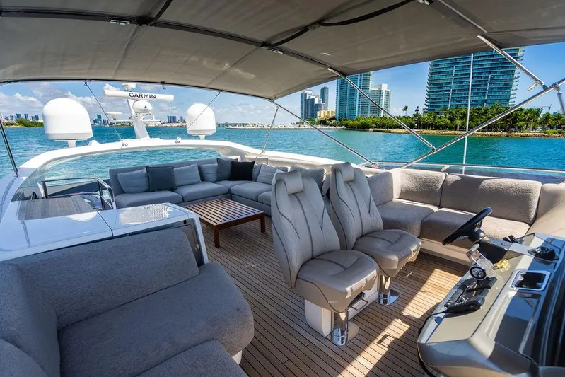 Cocoon Yacht Photos Pics Luxurious 2021 Princess S78 yacht interior with plush seating and scenic waterfront view.