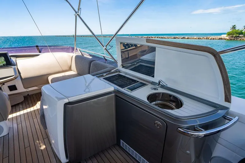 Cocoon Yacht Photos Pics Luxurious 2021 Princess S78 yacht deck with kitchenette and ocean view.