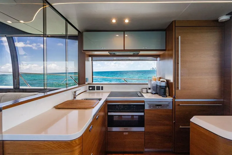 Cocoon Yacht Photos Pics Luxurious kitchen interior of 2021 Princess S78 yacht with ocean view.