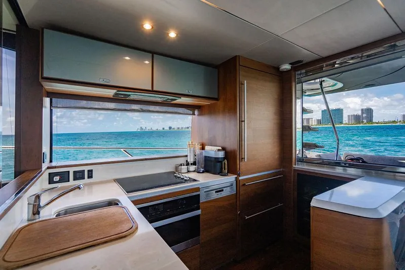 Cocoon Yacht Photos Pics Luxurious kitchen interior of 2021 Princess S78 yacht with ocean view.