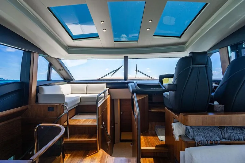 Cocoon Yacht Photos Pics Luxurious interior of 2021 Princess S78 yacht with skylights and elegant seating.