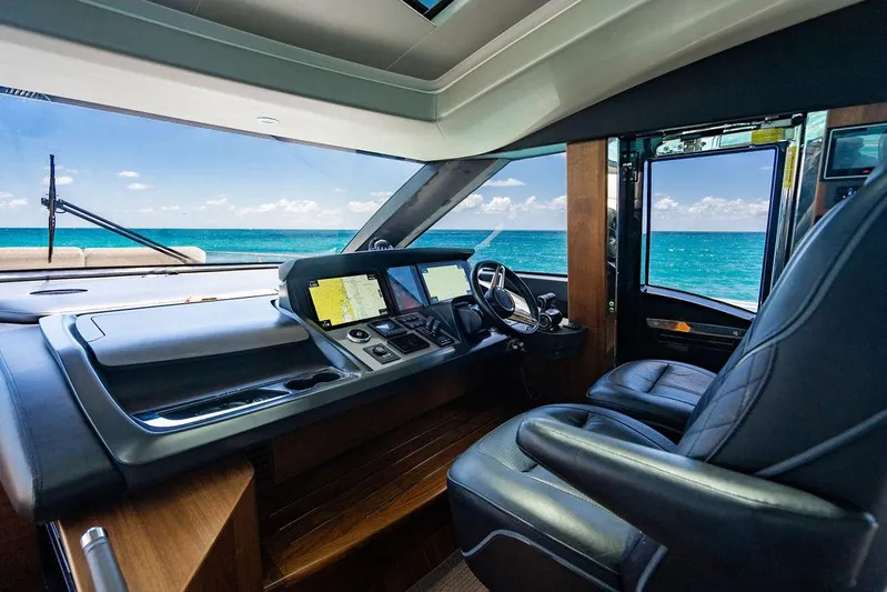 Cocoon Yacht Photos Pics Luxurious 2021 Princess S78 yacht cockpit with ocean view, featuring modern navigation equipment.