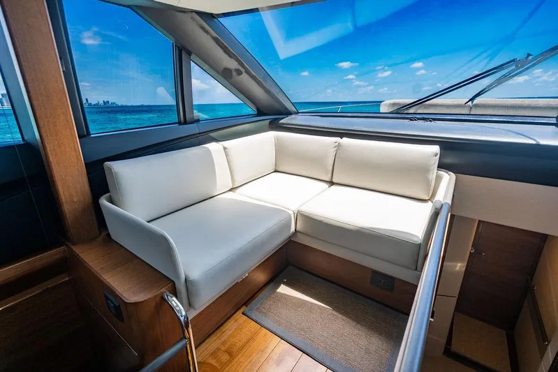 Cocoon Yacht Photos Pics Luxurious interior of 2021 Princess S78 yacht with ocean view through large windows.