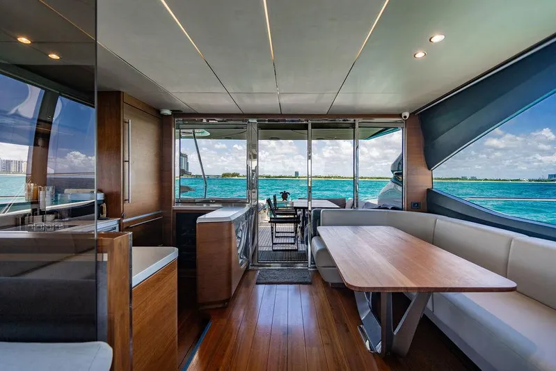 Cocoon Yacht Photos Pics Luxurious interior of 2021 Princess S78 yacht with ocean view and elegant dining area.