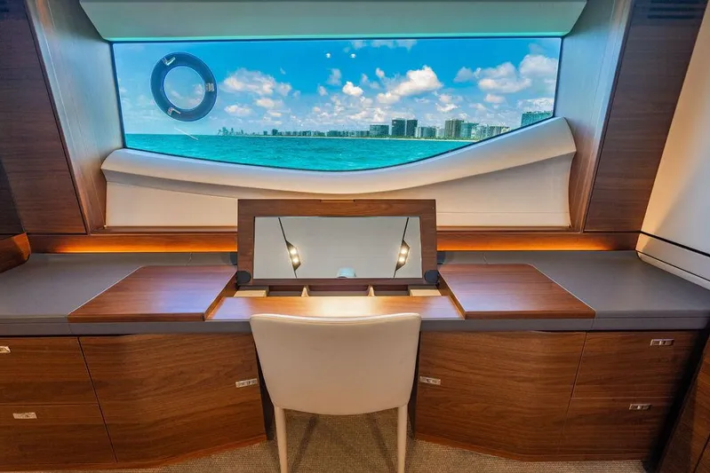 Cocoon Yacht Photos Pics Luxurious interior of 2021 Princess S78 yacht with ocean view through large window.