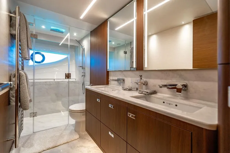 Cocoon Yacht Photos Pics Luxurious bathroom in 2021 Princess S78 yacht with dual sinks and modern shower.