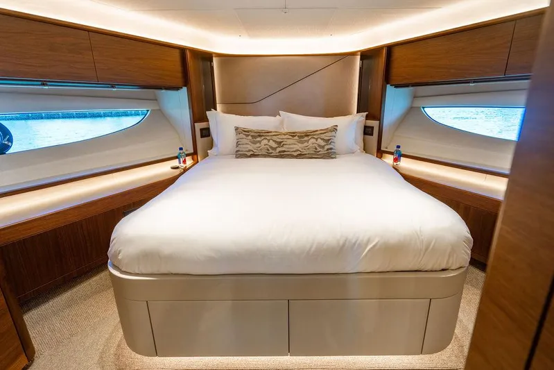 Cocoon Yacht Photos Pics Luxurious bedroom interior of 2021 Princess S78 yacht with elegant wood finishes.