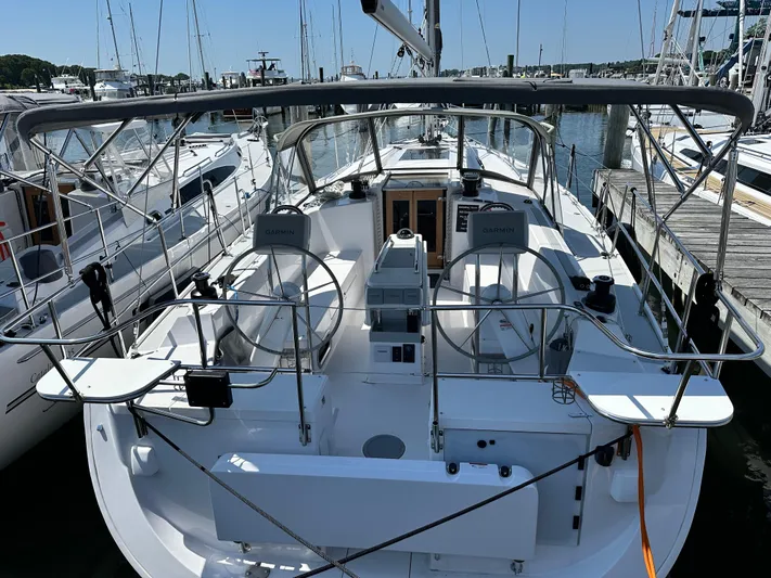 C426 #115 Yacht Photos Pics 2025 Catalina 426 yacht docked at marina, featuring dual steering wheels and modern navigation equipment.