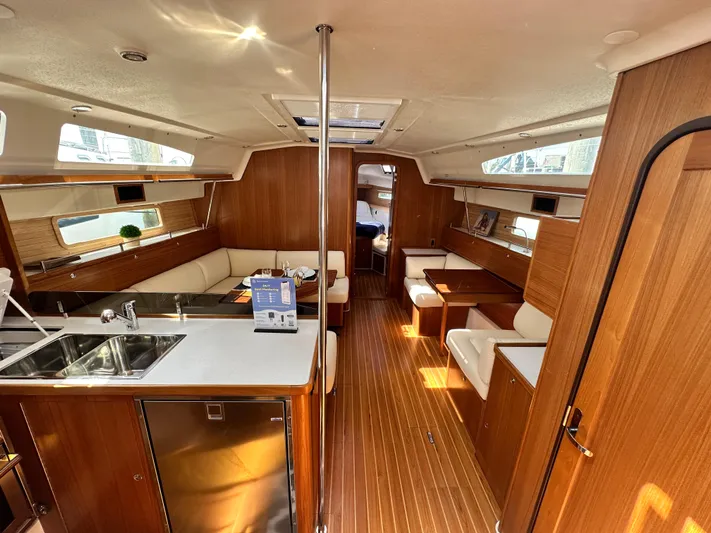 C426 #115 Yacht Photos Pics Luxurious interior of 2025 Catalina 426 yacht with modern kitchen and seating area.