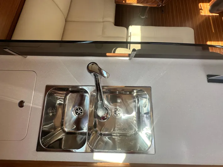 C426 #115 Yacht Photos Pics Modern kitchen sink in Catalina 426 yacht, 2025 model, with dual basins and sleek faucet.