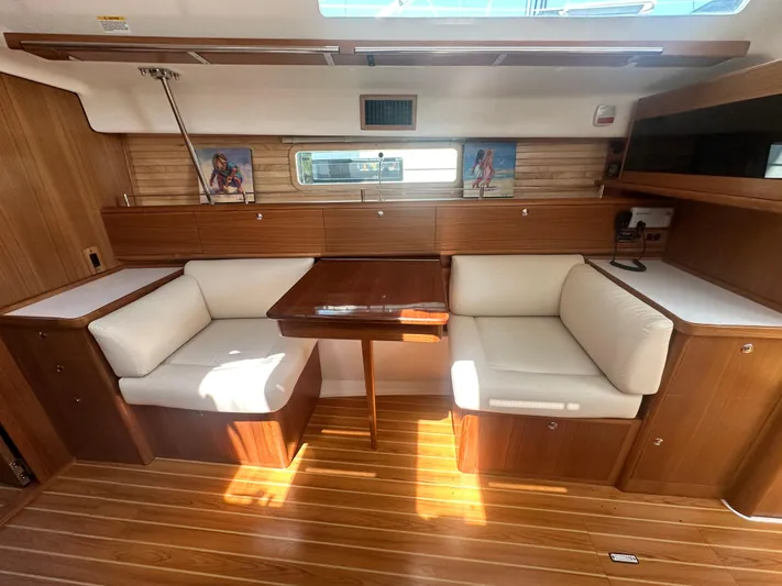 C426 #115 Yacht Photos Pics Luxurious interior of 2025 Catalina 426 yacht with wooden finish and white seating.