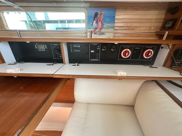 C426 #115 Yacht Photos Pics Interior of 2025 Catalina 426 yacht with control panels and seating area.