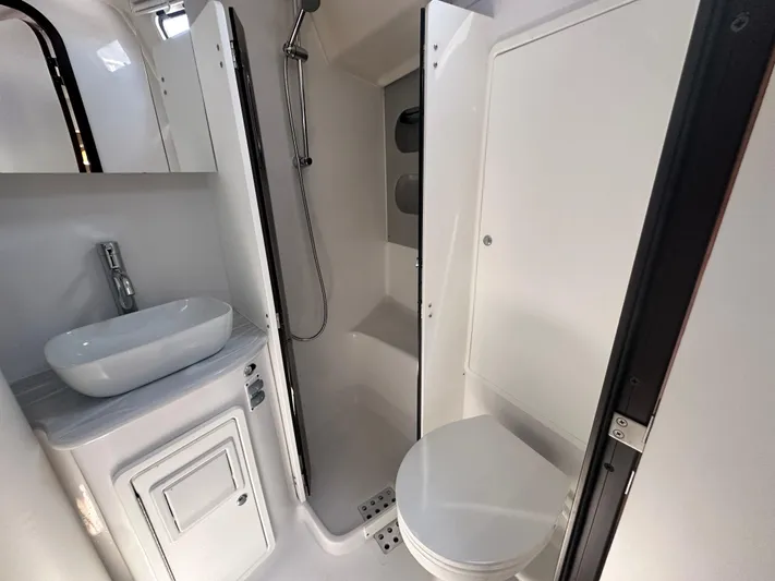 C426 #115 Yacht Photos Pics Modern bathroom in 2025 Catalina 426 yacht with shower, sink, and toilet.