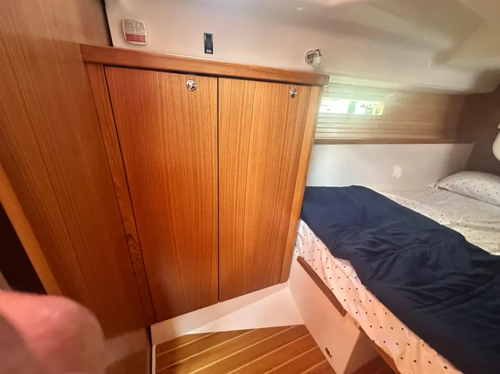 C426 #115 Yacht Photos Pics Cozy cabin interior of 2025 Catalina 426 yacht with wooden closet and bed.