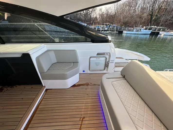  Yacht Photos Pics 2024 Fairline Targa 45 Open yacht with luxurious seating and waterfront view.