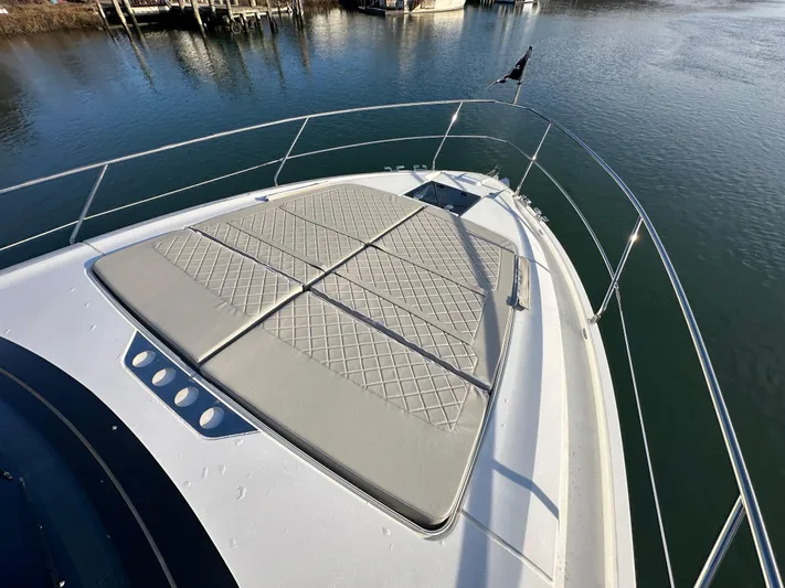  Yacht Photos Pics 2024 Fairline Targa 45 Open bow with sunpad, docked on calm water.
