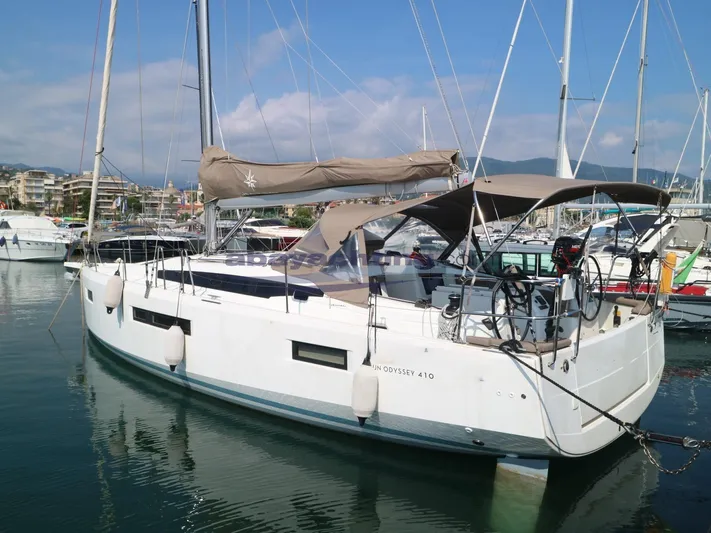  Yacht Photos Pics 2019 Jeanneau Sun Odyssey 410 sailboat docked in marina, featuring sleek design and modern amenities.
