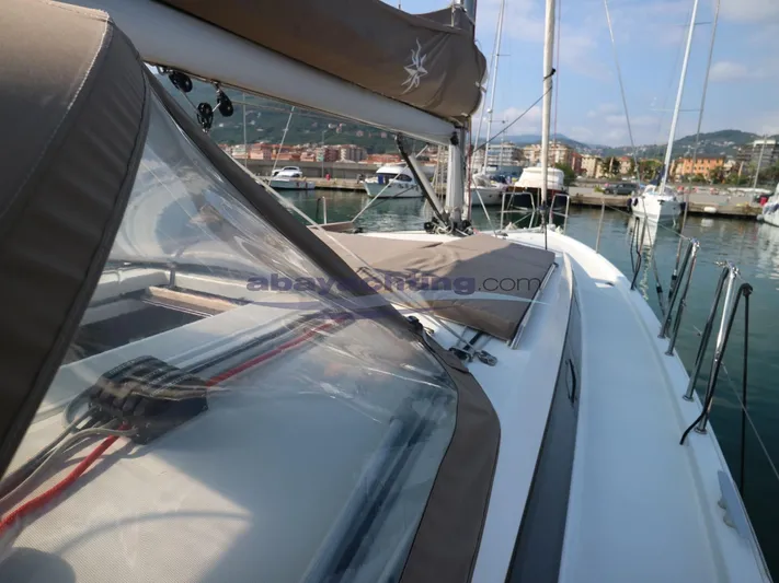  Yacht Photos Pics 2019 Jeanneau Sun Odyssey 410 sailboat docked at marina, showcasing deck and cockpit.