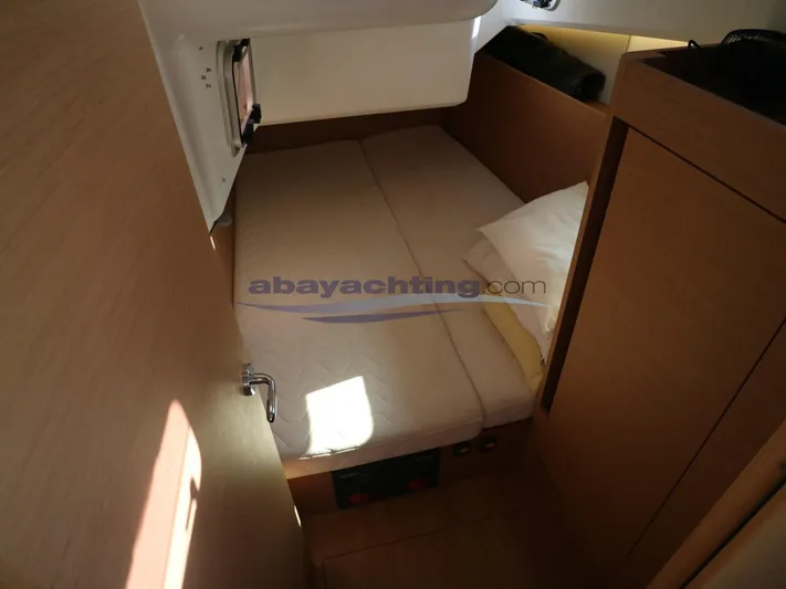  Yacht Photos Pics Cozy cabin interior of 2019 Jeanneau Sun Odyssey 410 sailboat.
