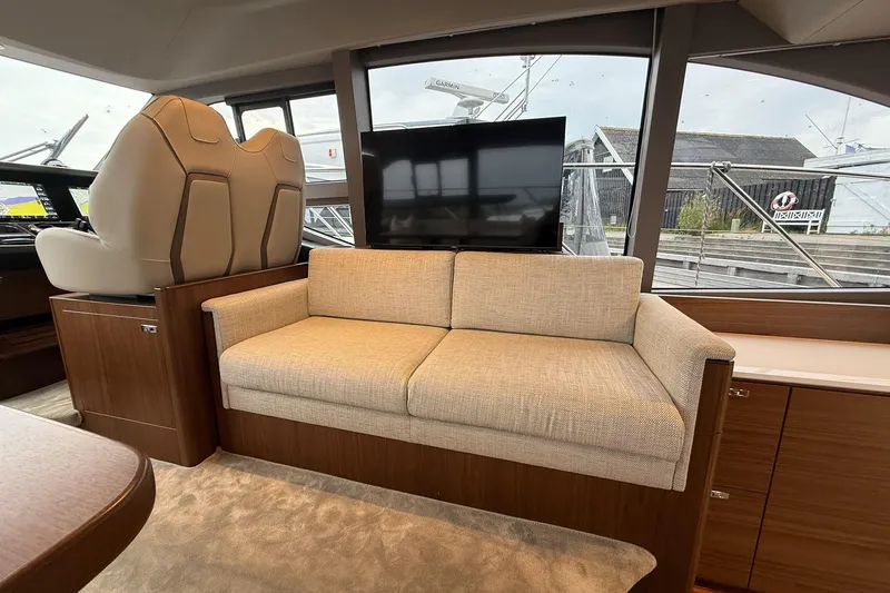 F50199 Yacht Photos Pics Luxurious interior of 2024 Princess F50 yacht with beige sofa and modern design.
