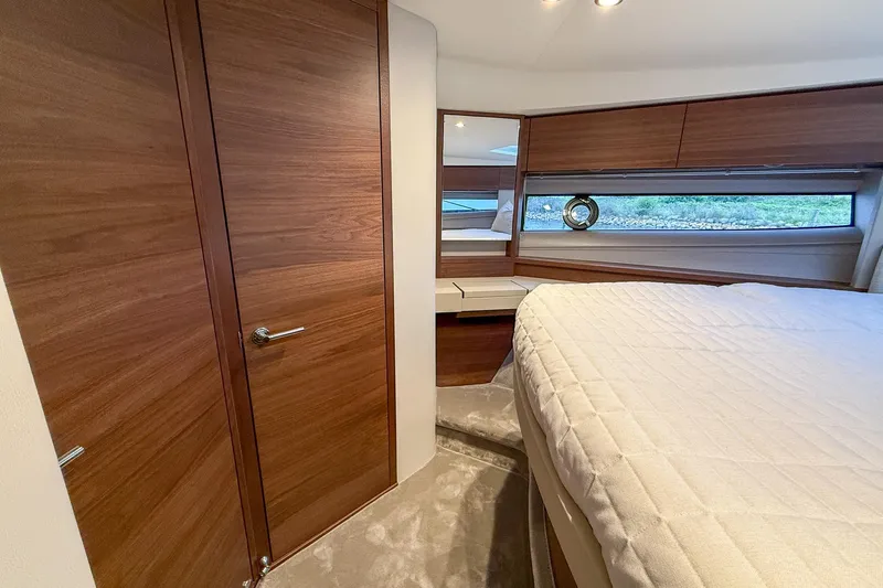 F50199 Yacht Photos Pics Luxurious 2024 Princess F50 yacht cabin with elegant wood finishes and modern design.
