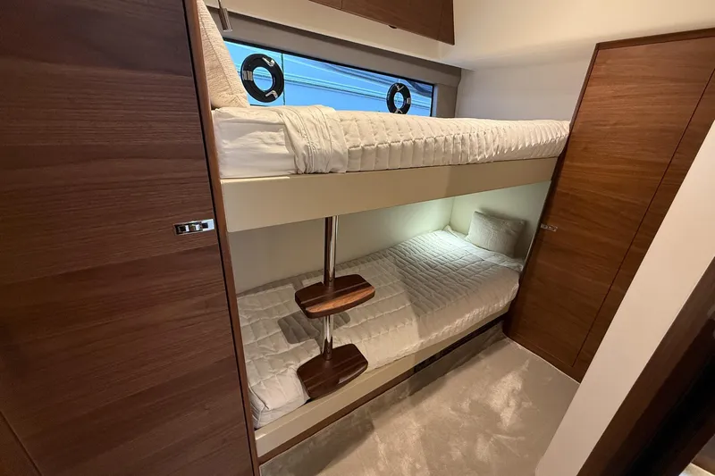 F50199 Yacht Photos Pics 2024 Princess F50 yacht interior with cozy bunk beds and wooden accents.