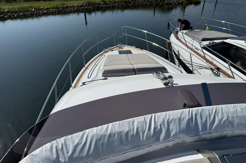 F50199 Yacht Photos Pics 2024 Princess F50 yacht docked in calm waters, showcasing sleek design and luxury features.