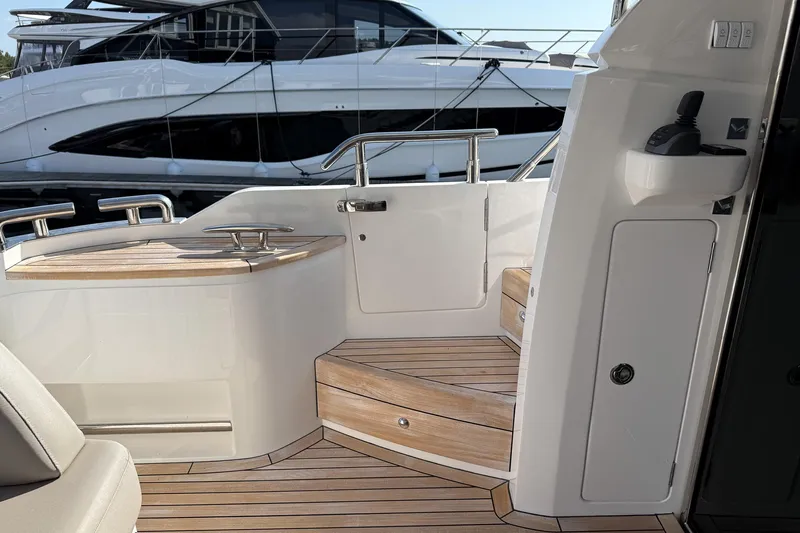 F50199 Yacht Photos Pics Luxurious 2024 Princess F50 yacht interior with elegant wooden steps and sleek design.