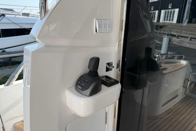 F50199 Yacht Photos Pics Control panel on 2024 Princess F50 yacht, featuring joystick and switches.