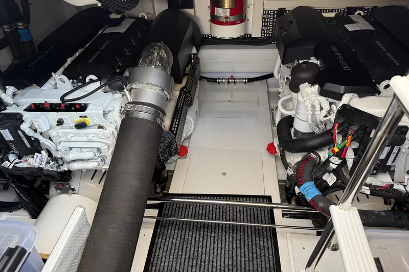 F50199 Yacht Photos Pics Engine room of a 2024 Princess F50 yacht, showcasing dual engines and mechanical components.