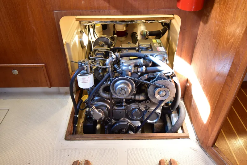 Promises Yacht Photos Pics Engine compartment of a 1998 Island Packet 350 sailboat, showcasing mechanical components.