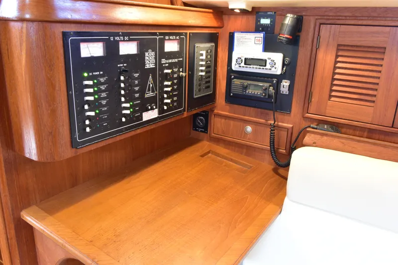 Promises Yacht Photos Pics Navigation station of a 1998 Island Packet 350 yacht with control panels.