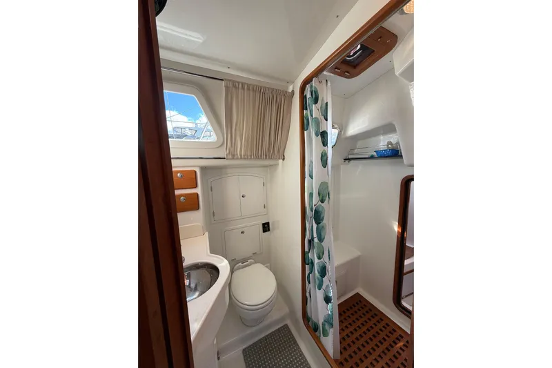 Pratique Yacht Photos Pics Bathroom interior of 2012 Outbound 46 yacht with shower and toilet.