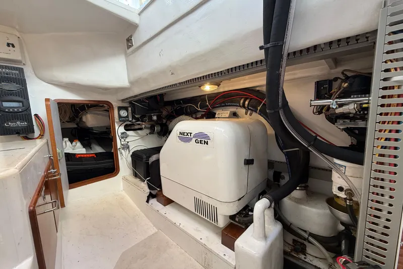 Pratique Yacht Photos Pics Engine room of 2012 Outbound 46 yacht with Next Gen generator and equipment.