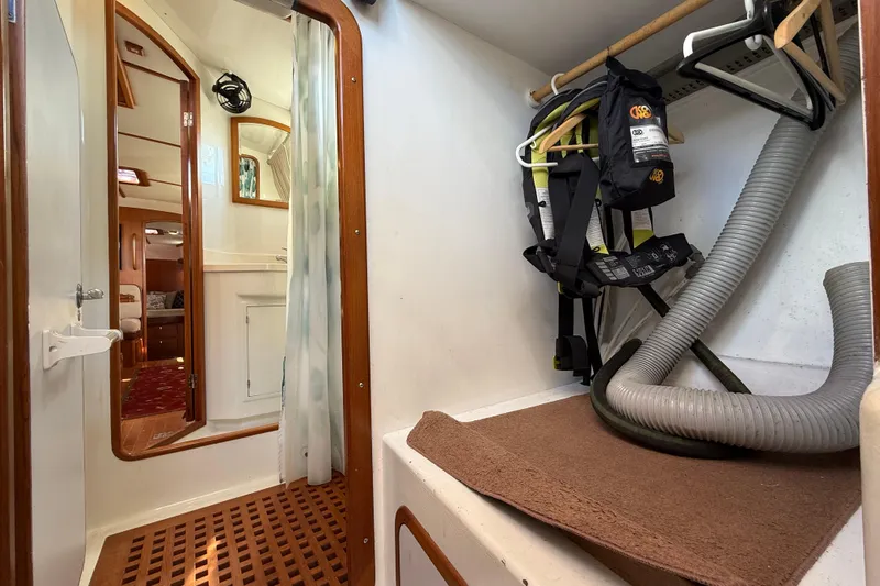 Pratique Yacht Photos Pics Interior of 2012 Outbound 46 yacht with storage area and safety equipment.