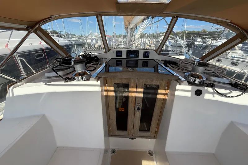 Pratique Yacht Photos Pics Cockpit of 2012 Outbound 46 sailboat with navigation equipment and winches.