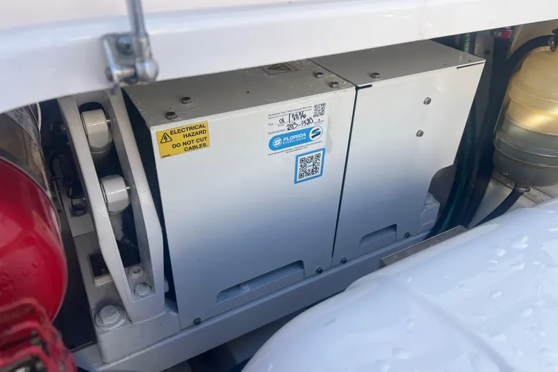 Yacht Photos Pics Electrical system in 2019 Pursuit S 368 Sport boat, featuring safety warning labels.