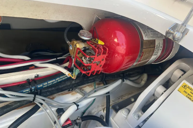  Yacht Photos Pics Fire extinguisher in 2019 Pursuit S 368 Sport boat engine compartment.