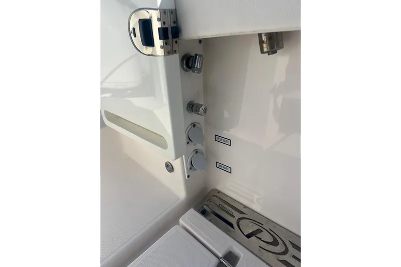  Yacht Photos Pics 2019 Pursuit S 368 Sport boat interior with fresh and raw water controls.