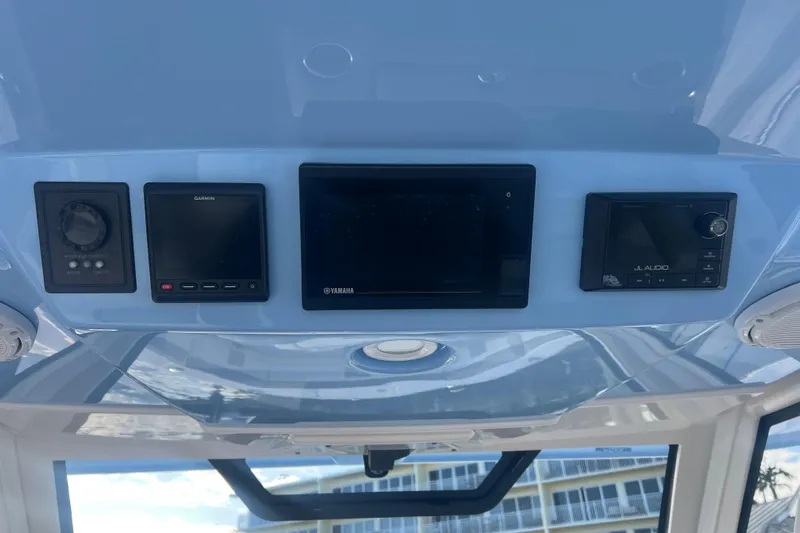  Yacht Photos Pics 2019 Pursuit S 368 Sport dashboard with Garmin, Yamaha, and JL Audio displays.