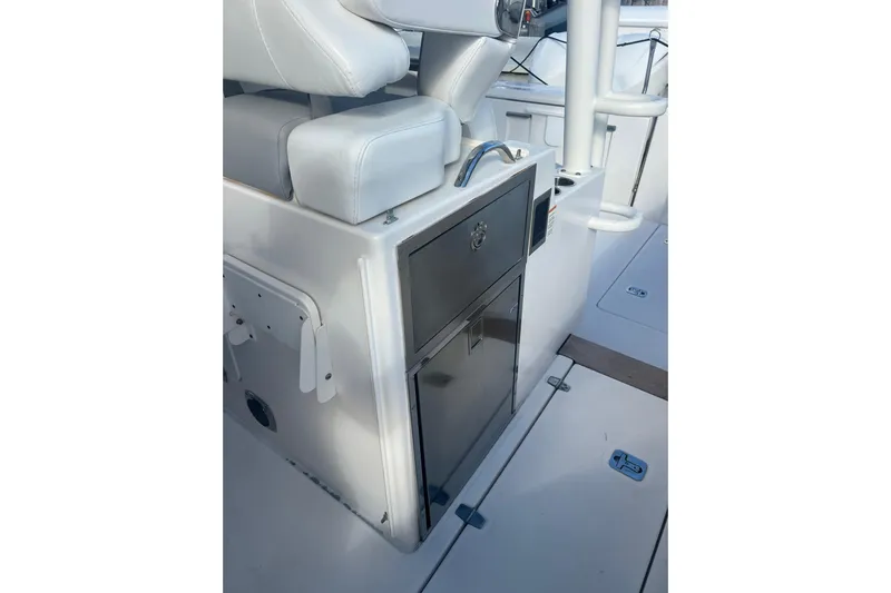  Yacht Photos Pics 2019 Pursuit S 368 Sport boat interior with seating and storage compartments.