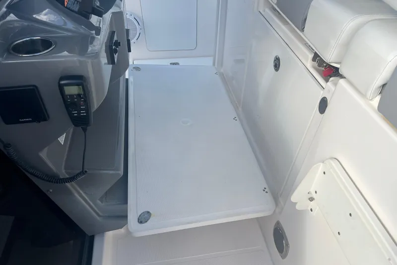  Yacht Photos Pics 2019 Pursuit S 368 Sport boat interior with seating and control panel.