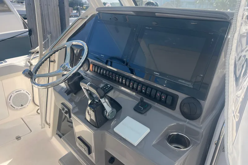  Yacht Photos Pics 2019 Pursuit S 368 Sport boat helm with dual screens and controls.
