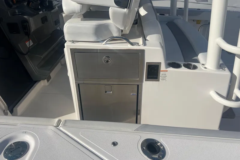  Yacht Photos Pics 2019 Pursuit S 368 Sport boat interior with seating and storage compartments.