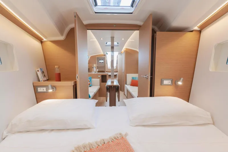  Yacht Photos Pics Luxurious interior of 2026 Jeanneau Sun Odyssey 350 yacht, featuring cozy cabin and modern design.