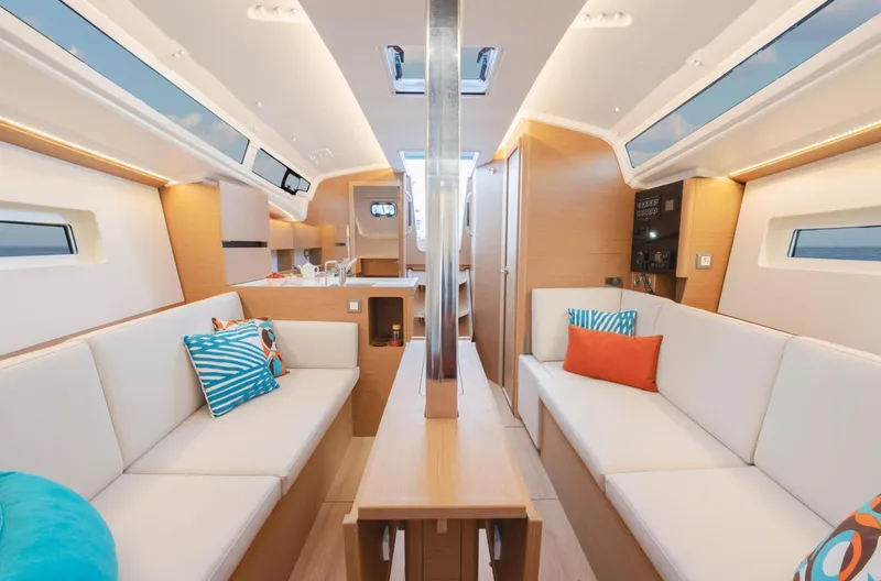  Yacht Photos Pics Interior of 2026 Jeanneau Sun Odyssey 350 yacht with modern design and colorful cushions.