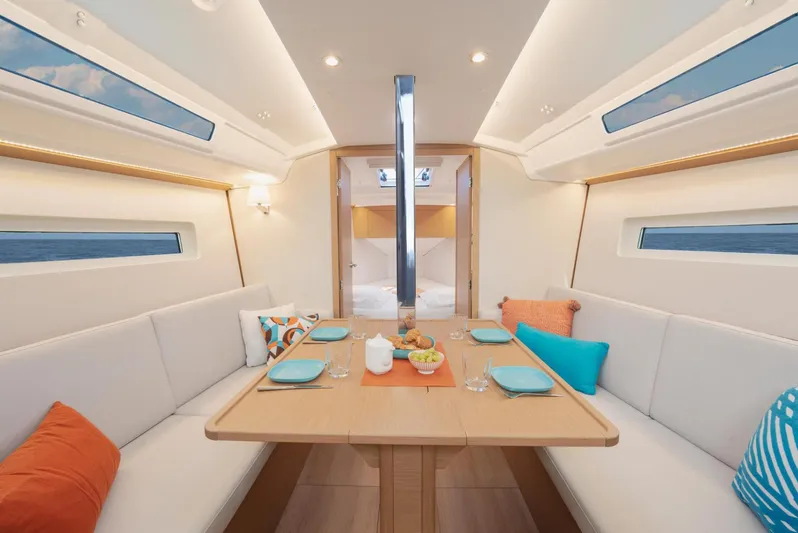  Yacht Photos Pics Interior of 2026 Jeanneau Sun Odyssey 350 yacht with elegant dining area and modern decor.